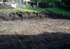 The start of excavation with foundation footings laid out.