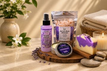 Lavender-themed bath products arranged on a wooden board.