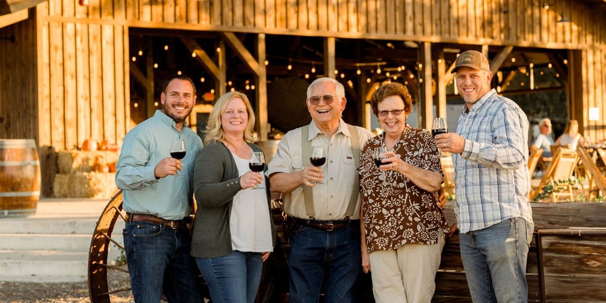 The Heringer family in front of their newly renovated 150 year old Heritage Barn, which serves as th