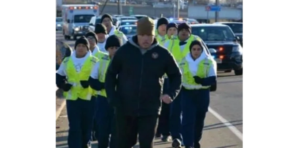 A man running with his group behind
