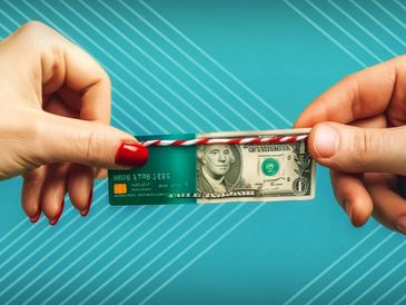 Two hands holding a credit card and a dollar bill connected by a string.