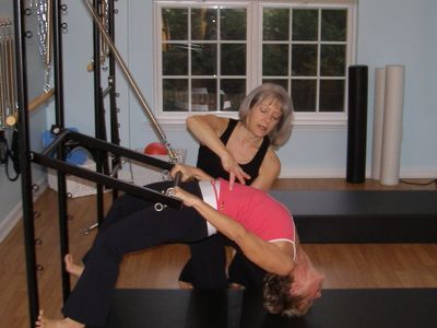 Assistance with Pilates backbend
