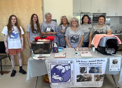 Group of volunteers at Elk Grove Animal Shelter Neonatal Kitten Care booth.