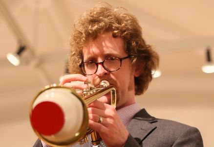 trumpeter josh mcdonald in a cup mute. He is a dedicated educator!