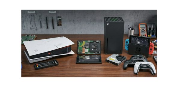 Damaged gaming consoles, including PlayStation 5, Xbox Series X, and Nintendo Switch, on a workbench with repair tools.