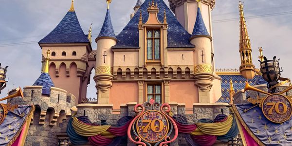 Disney castle decorated for its 70th anniversary celebration.