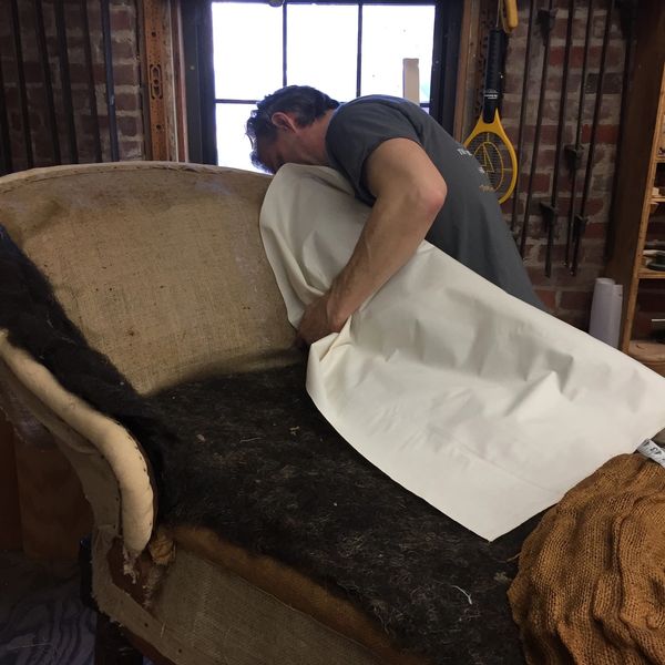 Adding padding to chaise lounge spring tied back and sides.