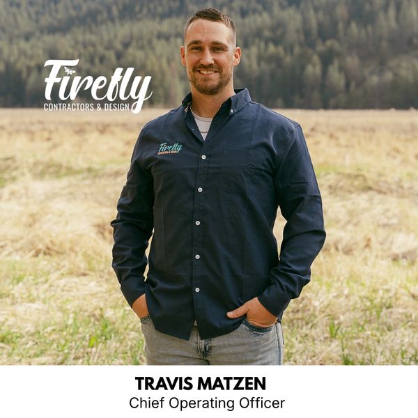 Travis Matzen, Chief Operating Officer of Firefly Contractors &amp; Design, stands outdoors with a smile.