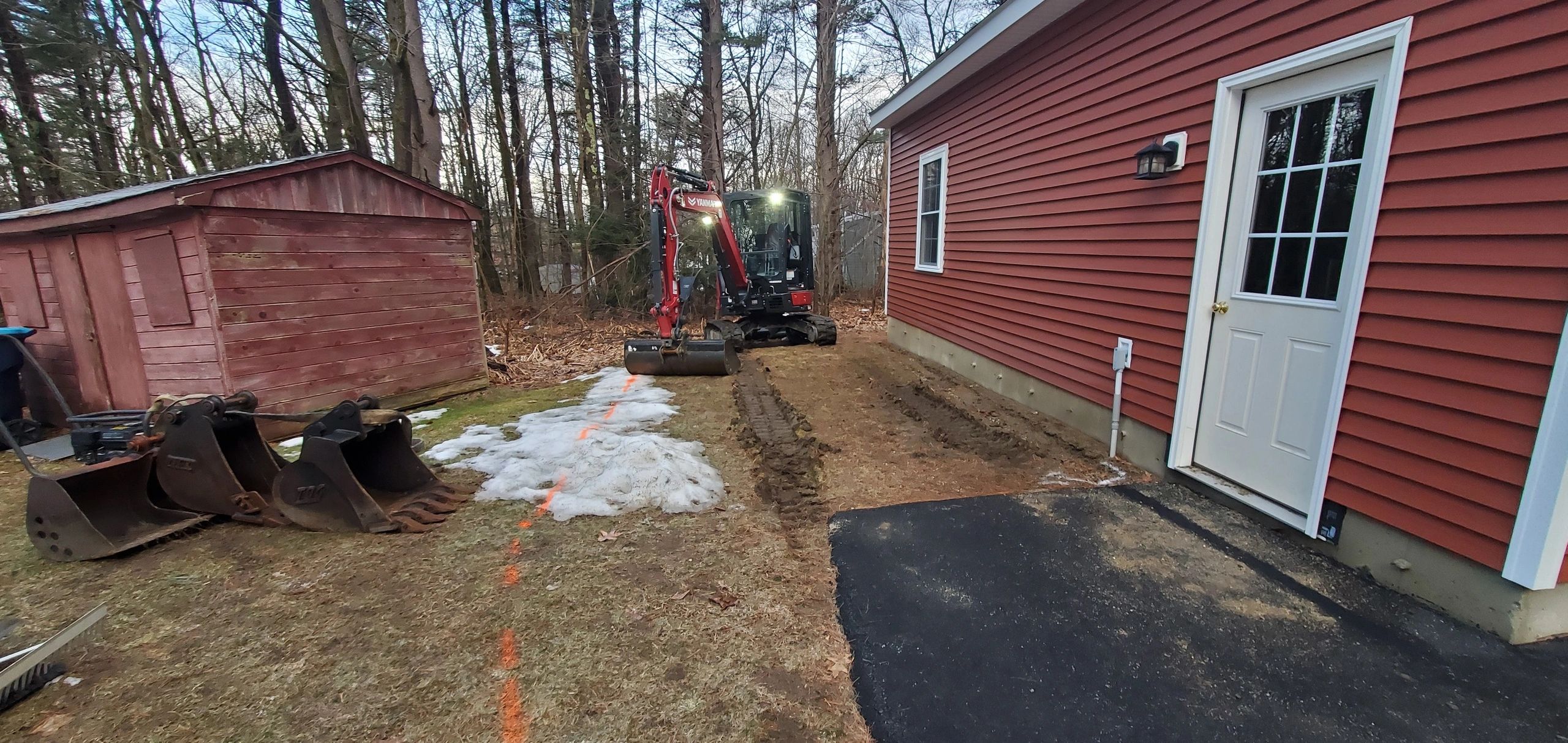 Expanding Driveway for a new camper with the mini excavator.  Hire us to help you