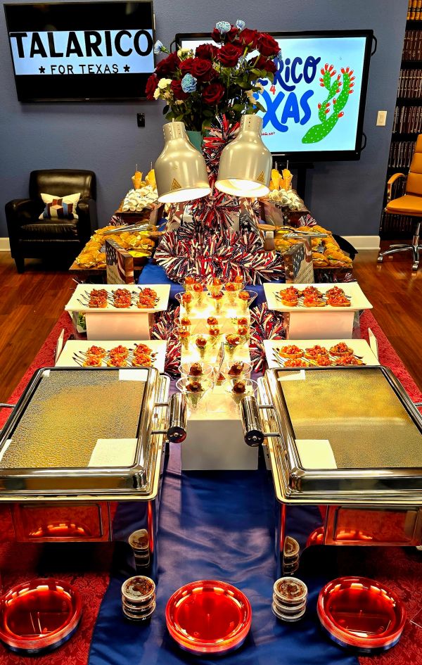Buffet setup with patriotic decorations and campaign signs.