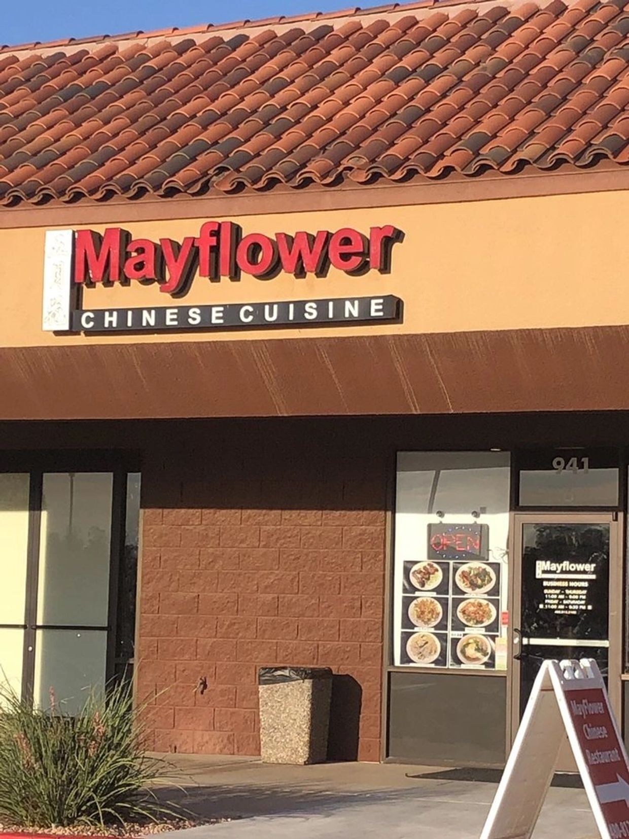 Mayflower Chinese Cuisine restaurant storefront with tile roof.