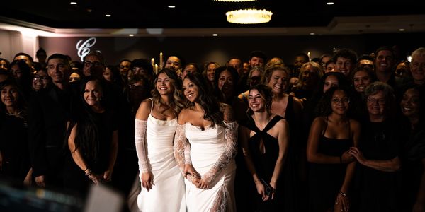 A large group of people dressed formally at an event.