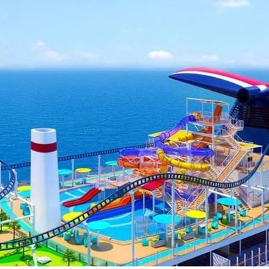 Colorful water slides and a roller coaster on a cruise ship deck by the ocean.