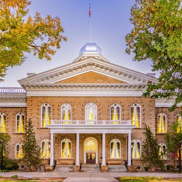 Historic government building with American flag.