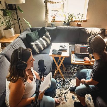 Two people recording a podcast at home.