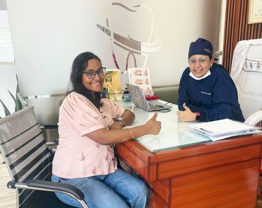 Young patient smiling after a dental visit at Vedanta Smiles Dental & Implant Centre.