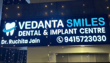 Vedanta Smiles Dental & Implant Centre clinic signage in Gurgaon