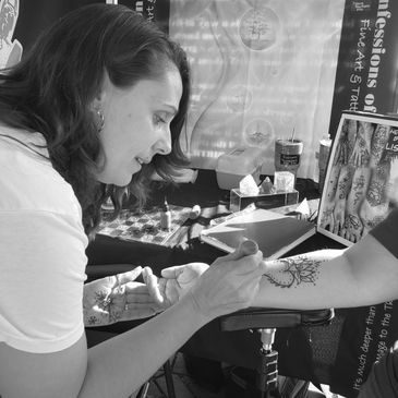 Lisa doing henna at a local market.