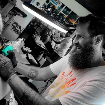 J.P. Decker tattoo artist and owner of Confessions of the Hand Tattoo a back piece.