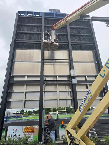Installing scoreboard at Xenia High School Doug Adams Stadium