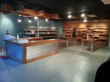 Lighting and custom shelving for local retail business
