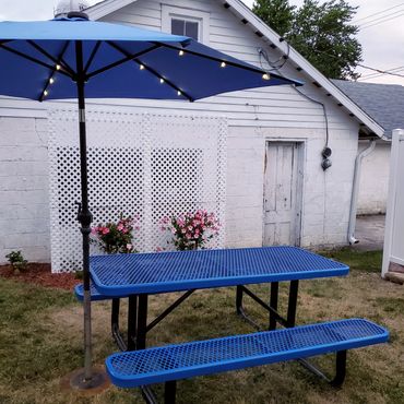 Picnic tables outdoors at Cream of the Crop Ice Cream Shop