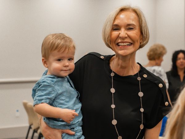 Pastor Jenny Roebert with her first grandson Micah Timothy Hofer at Faith Life Naples