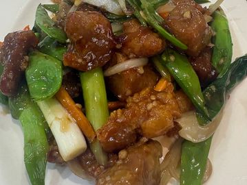 Stir-fried vegetables and crispy chicken in savory sauce.