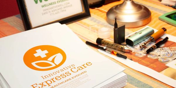 Brochure for Innovative Express Care on a table with vape pens and a lamp.