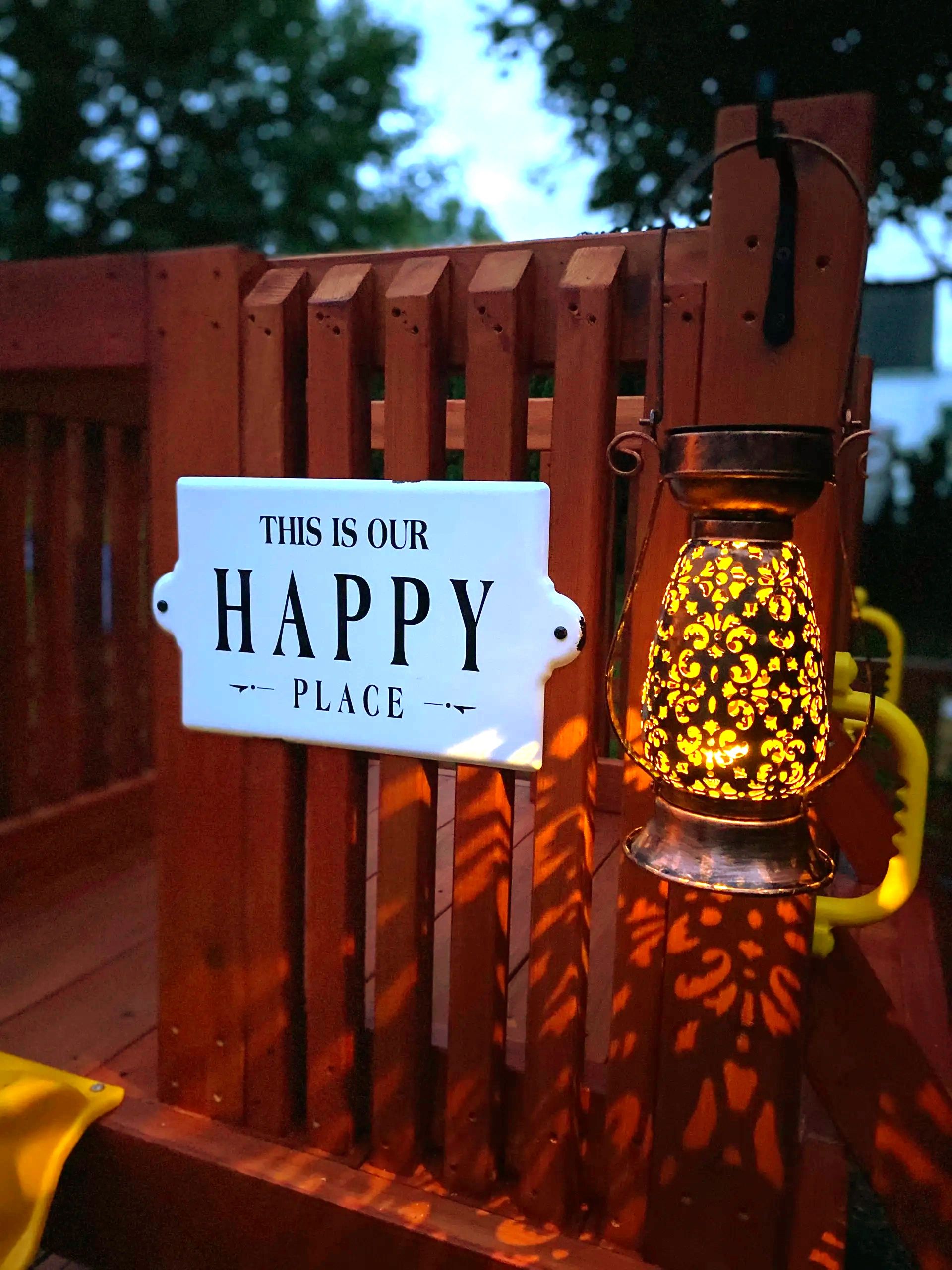 Preschool and Summer Camp playground with slide, fort and sign- this is our happy place.