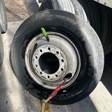 New 18 wheeler tire with wheel installed roadside on interstate 35