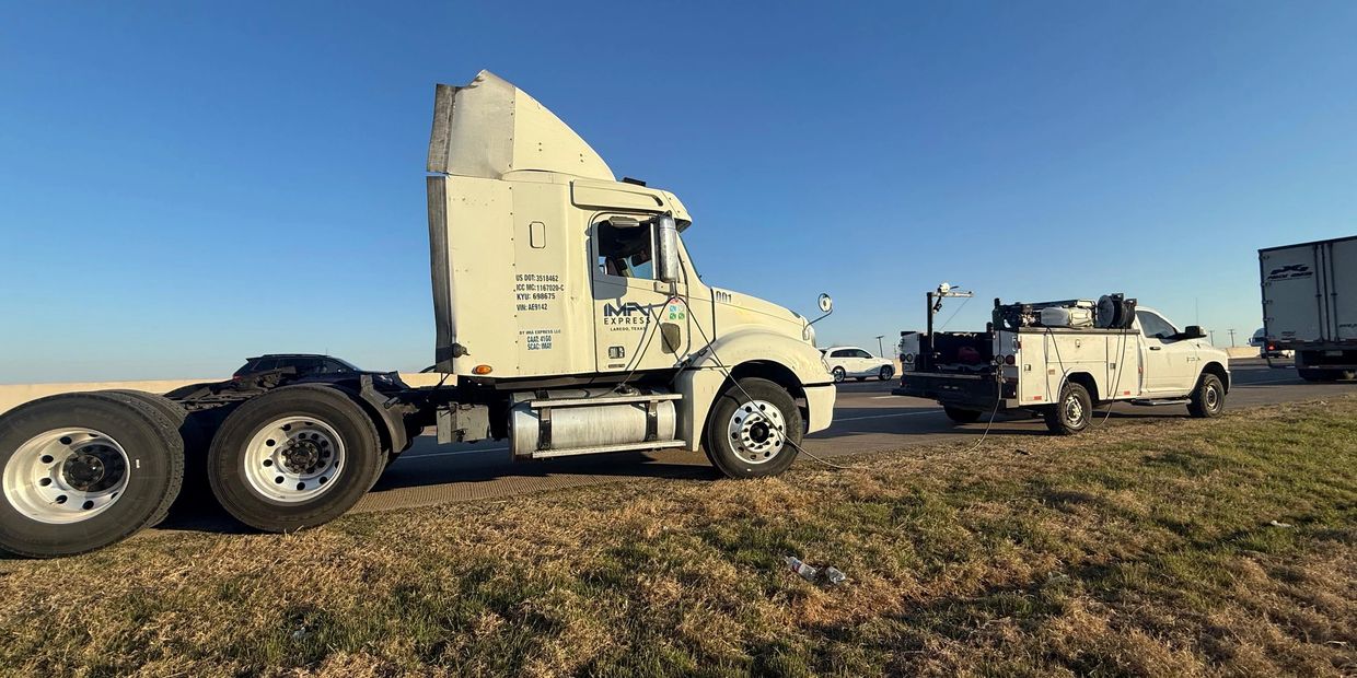 Waco Road Service truck providing on-site roadside assistance to a semi truck in need of repair. 