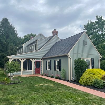 Residential home in York County, PA with new Mastic Vinyl Siding, vertical siding, sage green siding