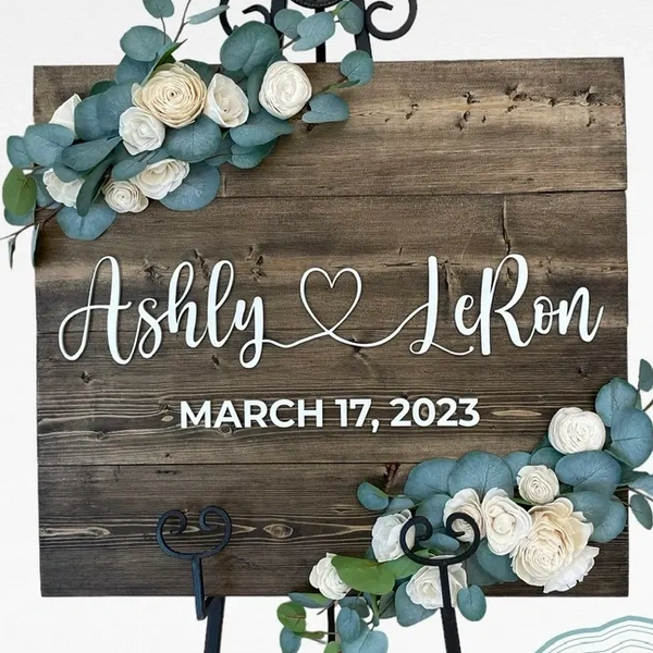 wood wedding sign with faux eucalyptus and wood flowers.