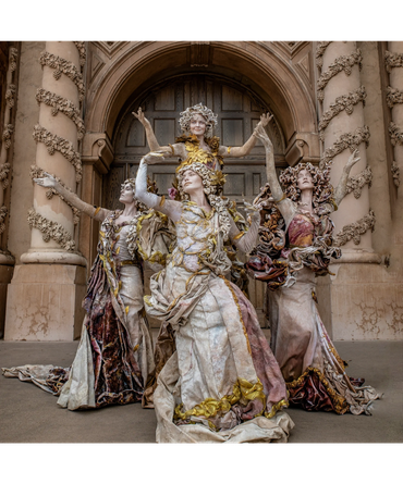 Statues performing in arched doorway
