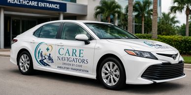 White Toyota sedan with healthcare transportation signage.