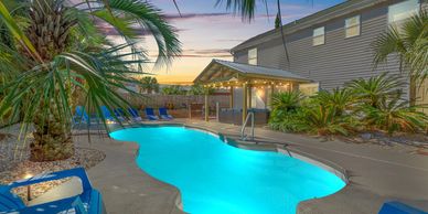 Pirates Cove is a private heated pool & hot tub home with a game room and is just steps 2 the beach