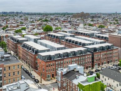 Aerial view of a dense urban area with row houses.