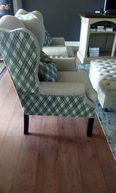 Elegant armchairs with patterned upholstery in a cozy living room.