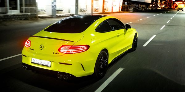 Merc C43 AMG wrapped in HEXIS Fluorescent Yellow Gloss