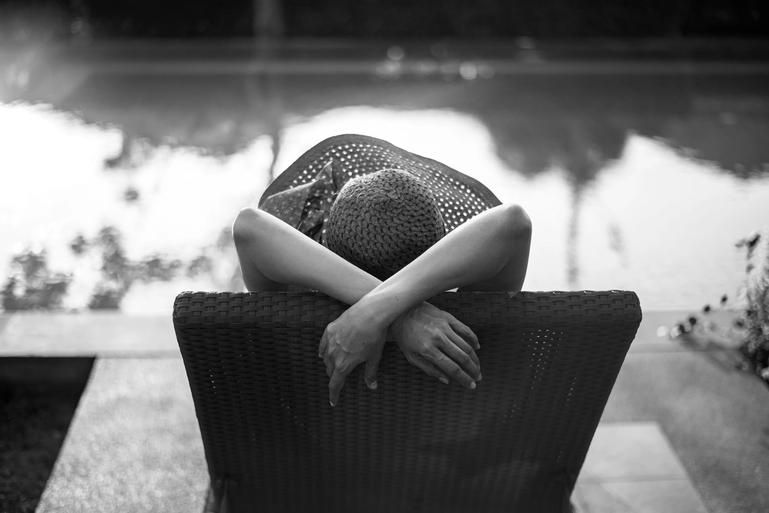 Woman relaxing by pool