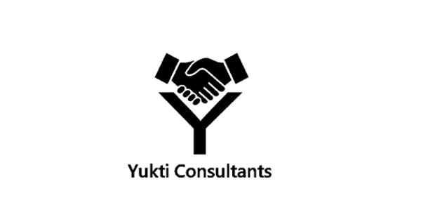 A man and a woman joyfully dancing in a studio with a rustic brick wall.