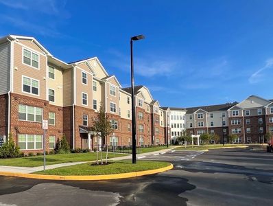 Photograph capturing pressure washing apartment buildings in Virginia.