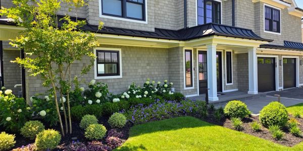 Modern house exterior with lush landscaping and well-maintained garden.