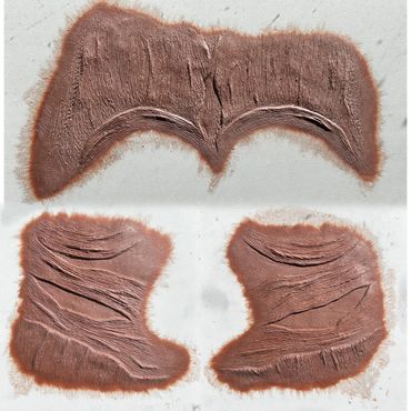 Clay sculpts of muscle found on your forehead and cheeks that will be made into prosthetic pieces