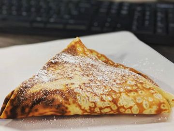 French sweet crepe with fresh sliced banana & Nutella.