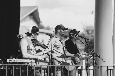 Band performing live on stage.