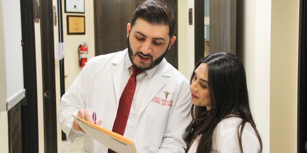 Dr. Tomassian, Family Physician reviewing labs