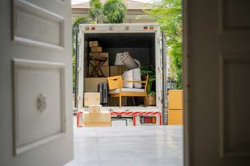 Fantastic Movers crew wrapping furniture before a move