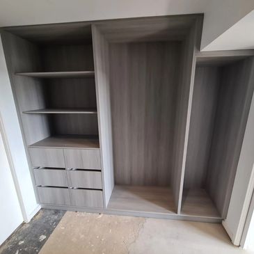 Custom-made woodmatt wardrobes with shelving and hanging rods. Montmorency VIC